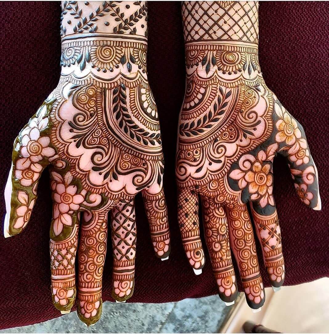 Intricate Floral and Geometric Henna Art on Hands