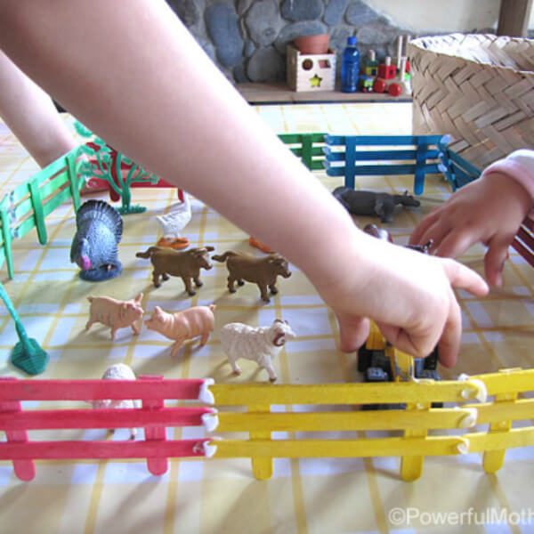 Fun Popsicle Stick Fencing Craft Activity With Little Plastic Farm Animal Toys - Creative Ways to Use Popsicle Sticks 