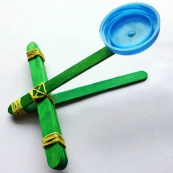 Handmade Catapult Popsicle Stick Craft Activity With Bottle Cap & Rubber Band - Ideas for Arts and Crafts Using Popsicle Sticks 