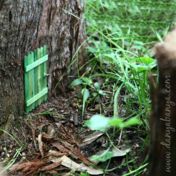 Mini Fairy Door Made With Popsicle Sticks On Tree - Fun and Creative Popsicle Stick Projects