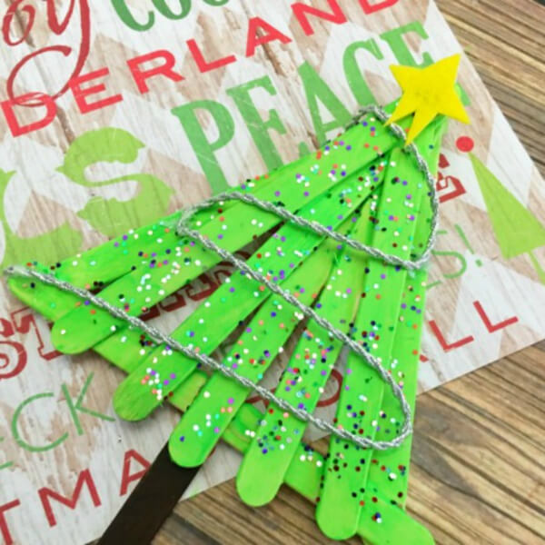 Adorable Christmas Tree Decoration With Popsicle Sticks, Pom Pom, Glitter & silver rope - Making Christmas Tree Ideas