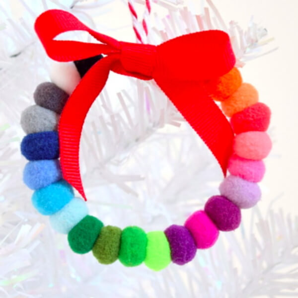 Adorable Pom Pom Wreath Craft With Ribbon & Yarn - Crafting a Christmas Wreath
