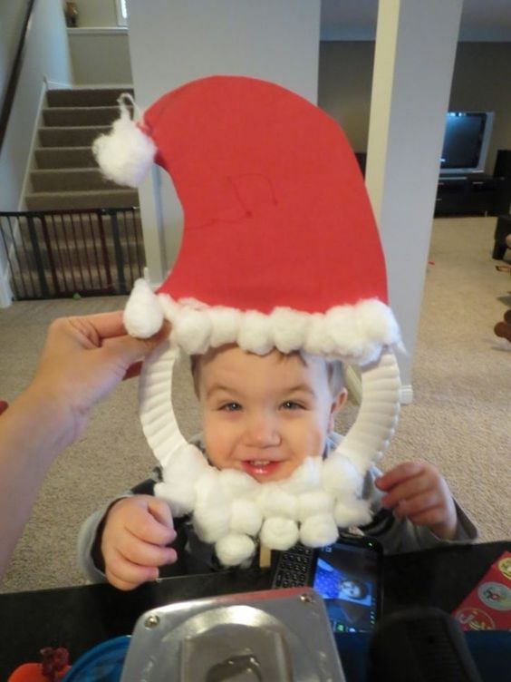 Adorable Santa Mask Christmas Craft Made With Paper Plate, Cotton Balls & Paper - Fun and easy Christmas projects for children.