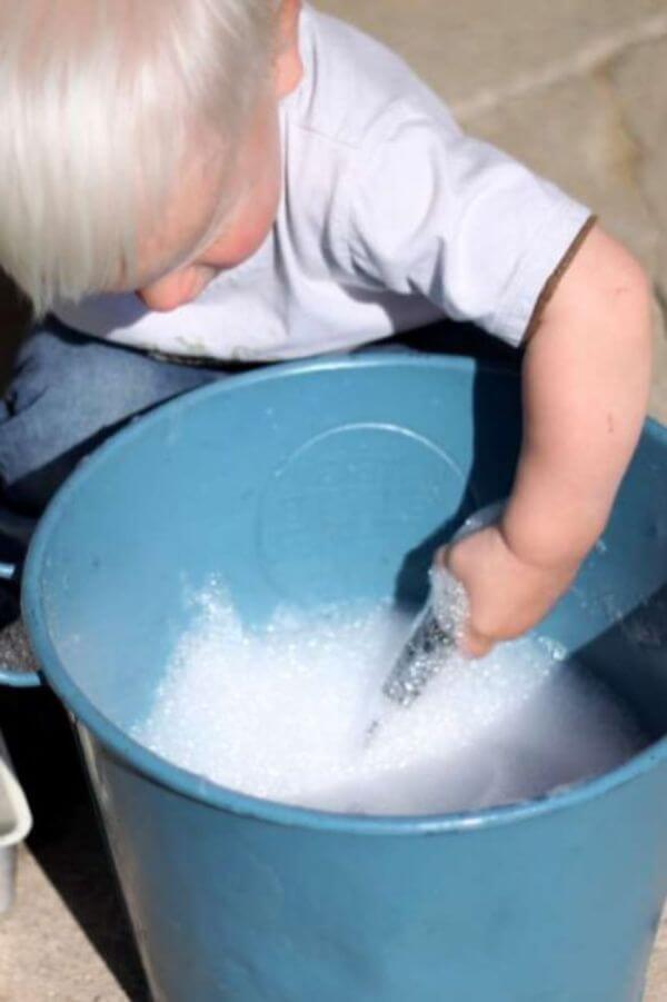 Bubbles Playing Activity In Bucket - Enjoyable tactile activities to assist in the growth of kids.