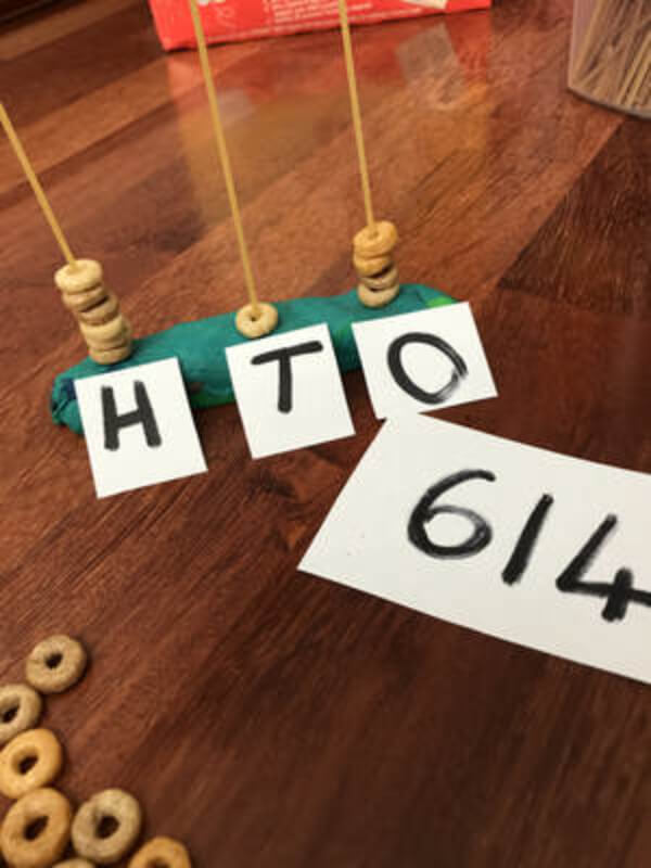 Build A Cherrio Place Value Towers Activity Using Playdough, Dry Spaghetti Sticks & Paper - Learning and Entertaining Yourself with Place Value Math