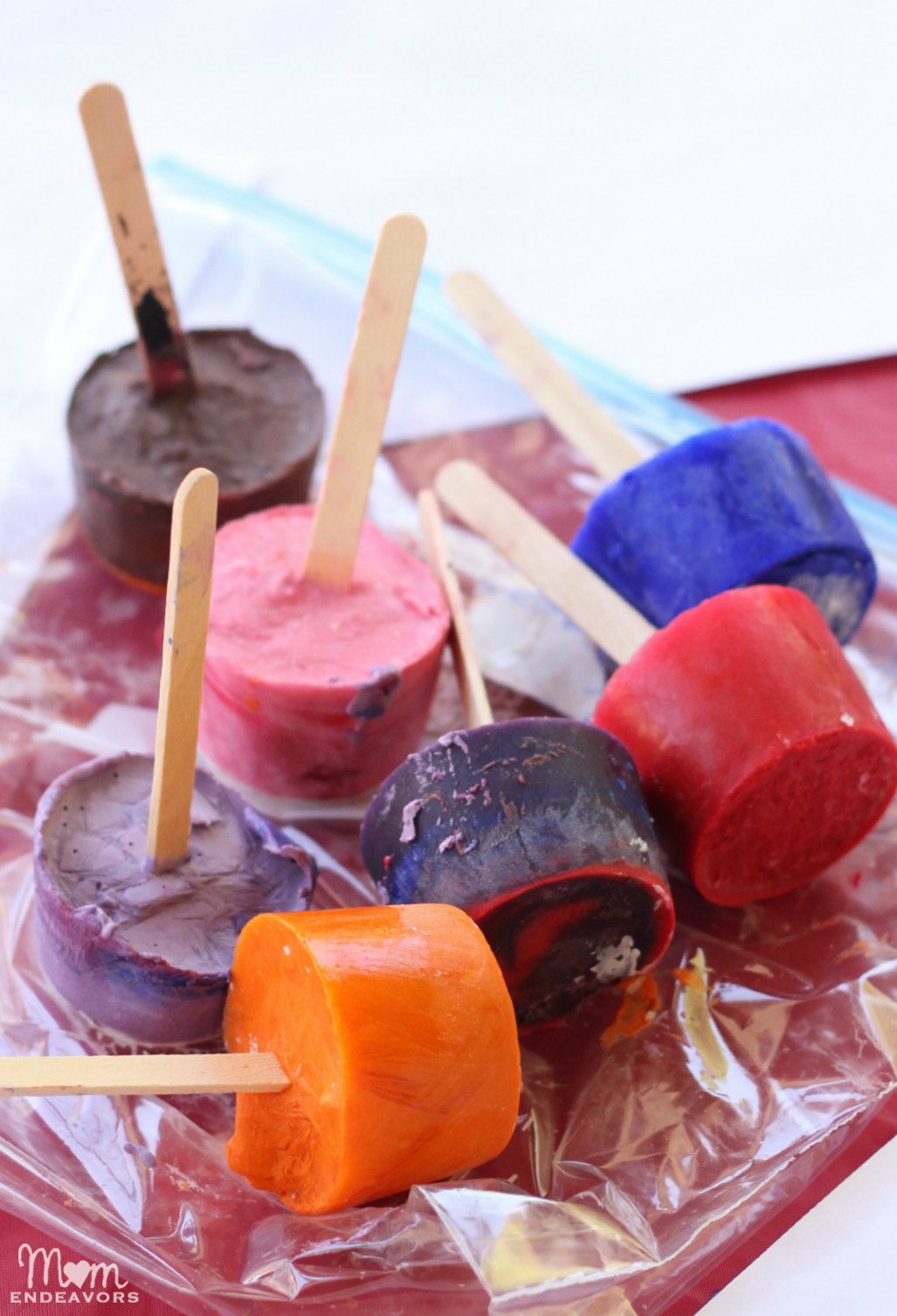 Colorful Frozen Ice Paints Activity Using Paper Cup, Popsicle Sticks & Tempera Paint - Ideas to get the kids out in nature. 