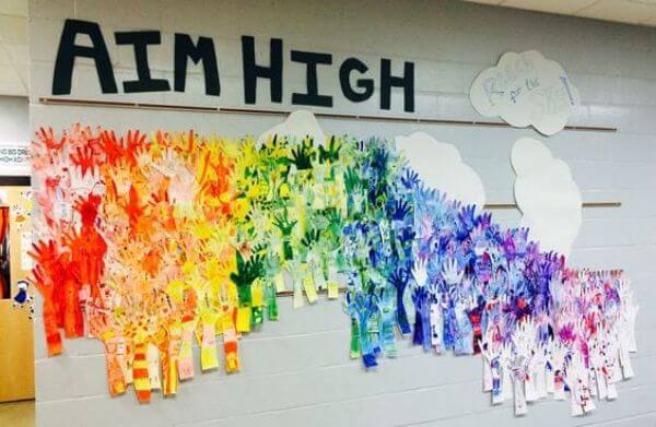 Colorful Hands Reaching Upwards - Motivate For Students From Bulletin Boards - Ways to Make the School Bulletin Board Pop with a Rainbow Theme