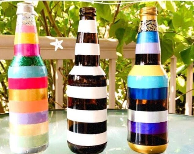 Colorful Stripe Painting On Plastic Bottles Using Different Colors - Applying artistry to bottles using paint