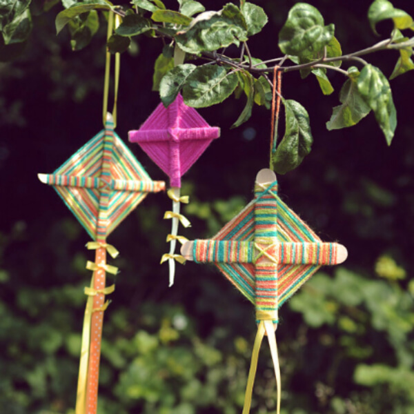 Colorful Yarn Kite Hanging Craft Using Popsicle Sticks & Ribbons - Crafting kites with preschoolers 