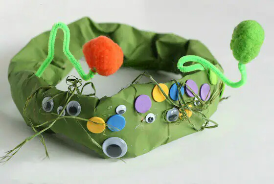 Creative Paper Bag Monster Hat Costume Idea Using Pom Pom, Pipe Cleaners, Googly Eyes, & Fabrics - Halloween Paper Bag Art Projects