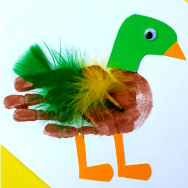 Cute Mallard Duck Handprint Art Idea With Paper, Googly Eyes, Paint, & Feathers - Handprint-based activities and art for little ones