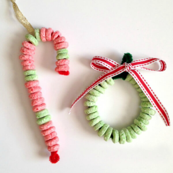 DIY Christmas Ornament Craft Made With Colorful Cereal, Pipe Cleaners & Ribbons - Artistic activities for preschoolers using cereal. 