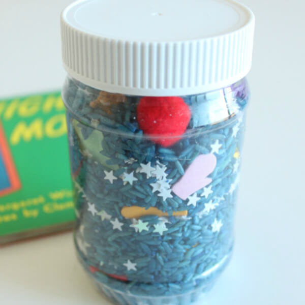 DIY Goodnight Moon Spy Discovery Bottle Made With Blue Rice, Plastic Jar, Stars & Some Items - Uncovering the exciting world of DIY discovery bottles for children.