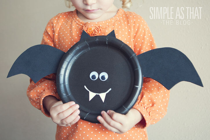 DIY Halloween Bat Decoration Craft At Home Using Paper Plate, Black Cardstock & Googly Eyes - Preschoolers can make exciting art projects with Halloween paper plates.
