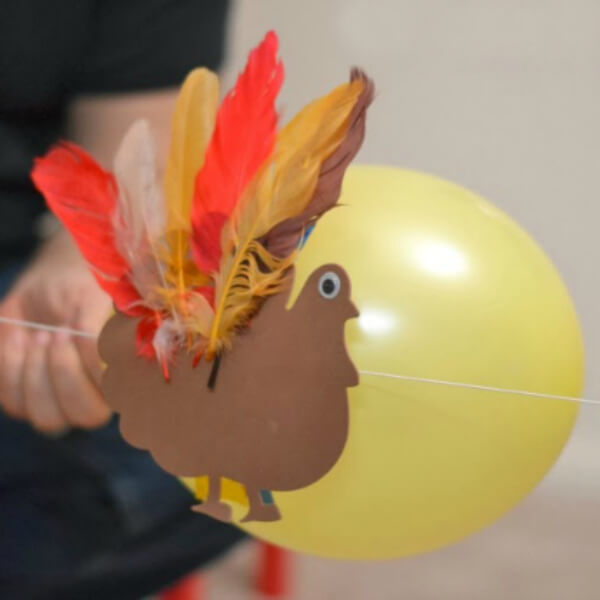 DIY Turkey Balloon Rocket Craft Activity With Colorful Feathers, String, Drinking Straws, Craft Foam & Googly Eyes - Arts & Crafts Celebrations for Kids on Thanksgiving