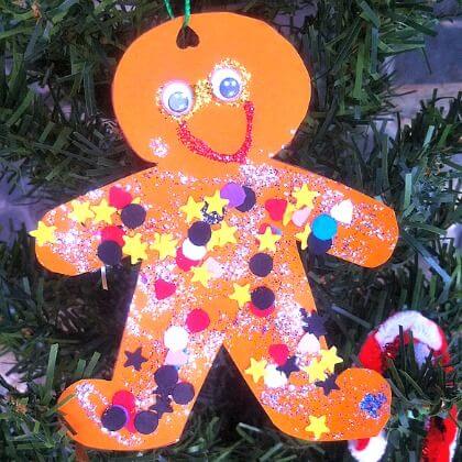 Easy Gingerbread Hanging Decoration Craft With Colorful Paper, Star Printables & Googly Eyes - Participating in gingerbread man-related activities for pre-primary school kids