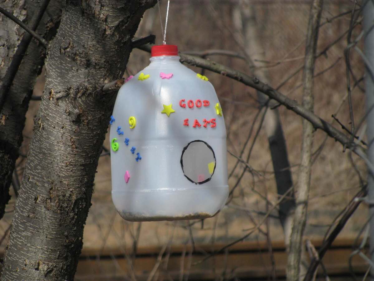 Easy To Make Bird Feeder Craft Using Decoration Stickers & Milk Jug Carton - Utilizing a milk carton to make a bird feeder