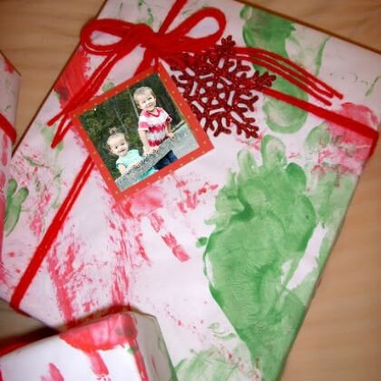 Easy To Make Christmas Wrapping Craft Activity With Baby Handprints, Paper & Ribbon - Joyful activities and creations for toddlers