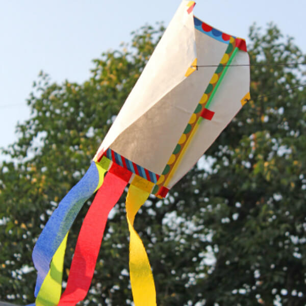 Easy To Make Kite Craft Using String, Tape, Tyvek Mailer, Drinking Straws, Cardboard, and Crepe Paper Strips - Assembling kites with preschoolers 