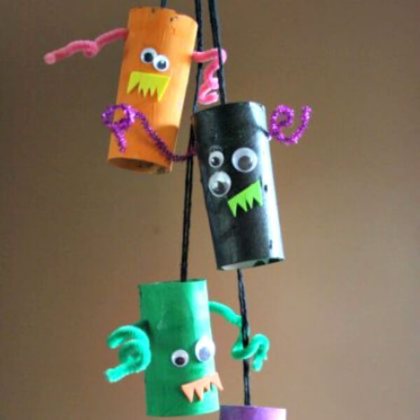 Easy To Make Monster Mobiles Craft Using Cardboard Tubes, Pipe Cleaners, Googly Eyes, Craft Foam & Yarn - Halloween-Inspired Art Projects for Preschoolers