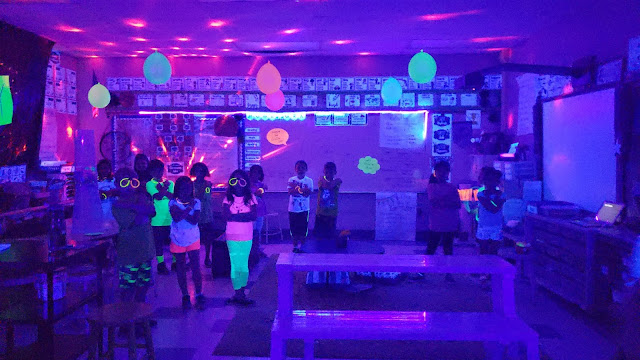 Exciting Glow Day Classroom Decoration Activity Using Glow Glasses, Black Light Reactive Balloons, Party Lights & Black Light Reactive Tape - Planning a GLOW DAY in the learning space
