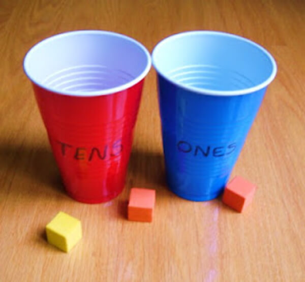 Fun Little Place Value Toss Game Activity With Paper Cups & Foam Shapes - Interesting Math Games to Master Place Value