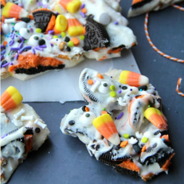 Halloween Bark Food Idea Using Orange and Black Sandwich Cookies, Candy Corn & Food Sprinkles - Do-It-Yourself Fall Snacks For Bigger Kids