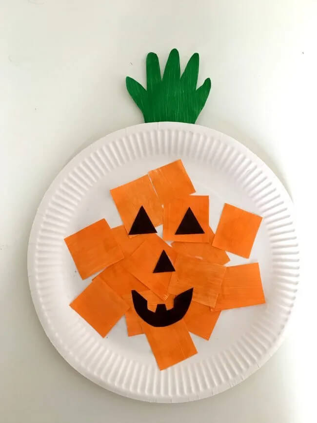 Halloween Themed Pumpkin Paper Plate Craft For Preschoolers Using Orange, Black & Green Paper - Preschoolers can be creative with Halloween paper plates.
