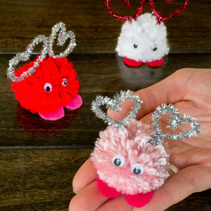 Handmade Pom Pom Monster Craft With Pipecleaner Heart Shaped On Top - Home-made Pom Pom projects for little ones