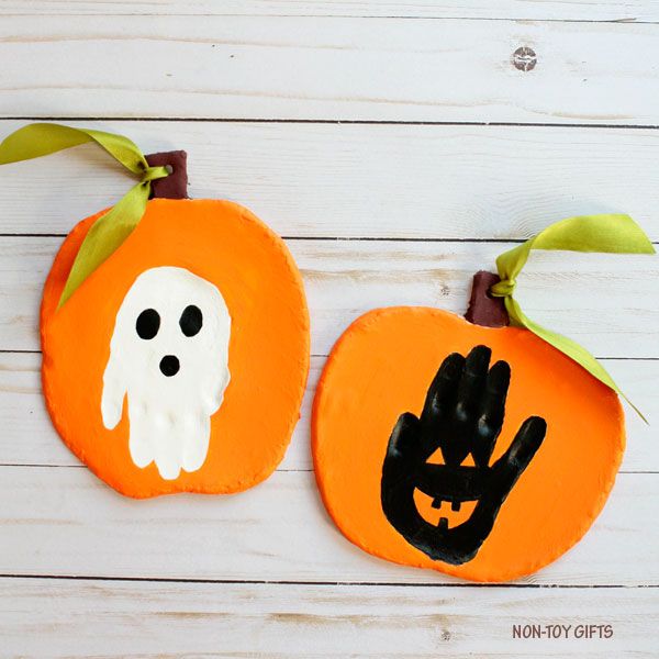 Handprint Halloween Ornament Decoration Craft Using Salt Dough - Entertaining Pumpkin Creations for Kids 