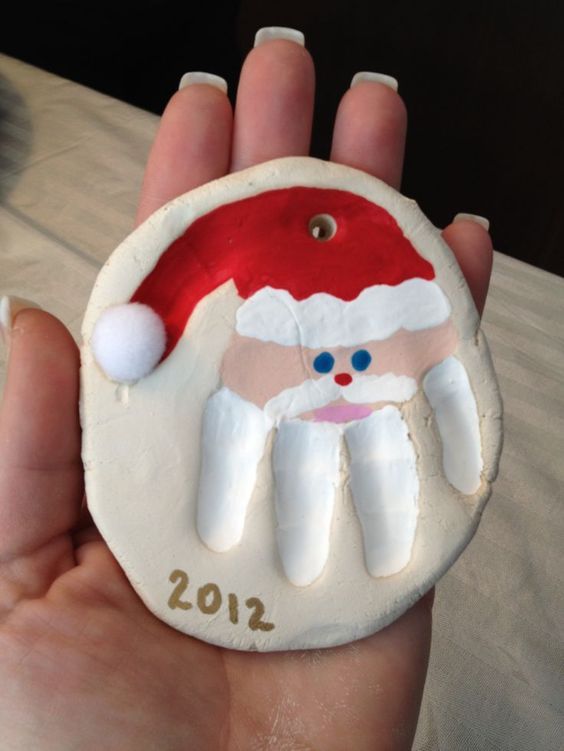 Handprint Santa Craft On Salt Dough - Christmas Art Projects for Toddlers and Preschoolers Made with Handprints 