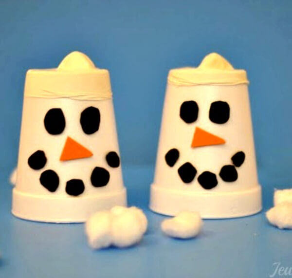 How To Make Snow Shooter's Activity Using White Cups, Orange, Cotton Balls, Black Craft Foam, and White Balloons - Making the Most of Snow with Fun Activities for Kids