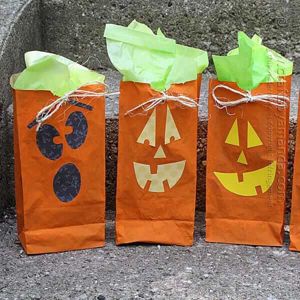 Jack O’ Lantern Treat Bags Craft Using Tissue Paper, Scrapbook Paper, Raffia & Craft Paint - Creative Halloween Paper Bag Ideas