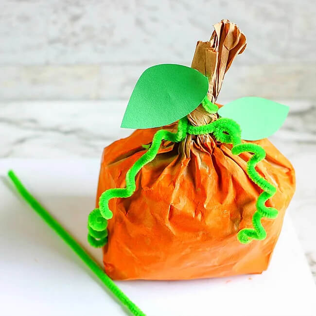 Joyful Halloween Pumpkin Paper Bag Craft With Green Construction Paper, & Pipe Cleaners - Crafting Projects Using Halloween Paper Bags