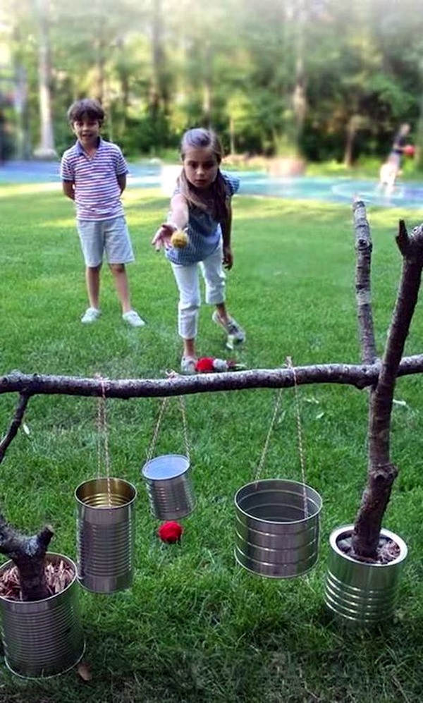 Placing The Ball In Tin Cans - Very Easy Game Activity For Kids - Engaging in backyard activities for kids.