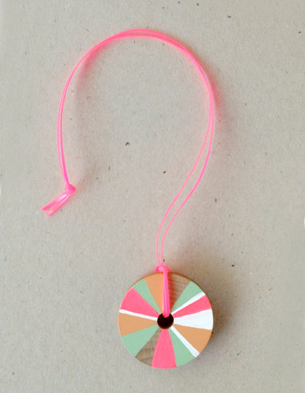 Pretty Pinwheel Necklace Craft Project Using a Wooden Wheel, Acrylic Paints & Yarn - Creative Do-It-Yourself Projects and Activities to Enjoy With the Kids