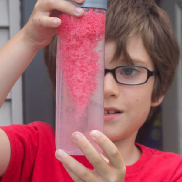 Sensory Bottle Absorption Experiment Activity With Play Sand, Moon Dough, & Water Beads - Creative ways to have fun with your children using homemade discovery bottles.
