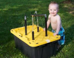 Simple Water Fountain Playing Activity In Backyard