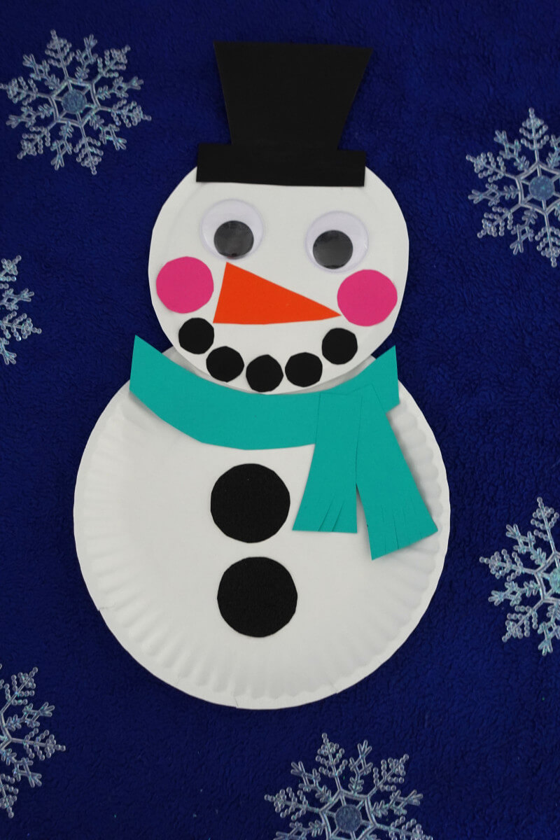 Super Simple Paper Plate Snowman Craft Tutorial For Kindergartners - An easy snowman craft for kids - using a paper plate. 