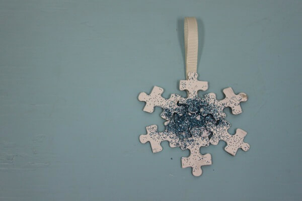 Beautiful Glittery Snowflake Ornament Craft With Puzzle Pieces - Environmentally friendly homemade holiday decorations