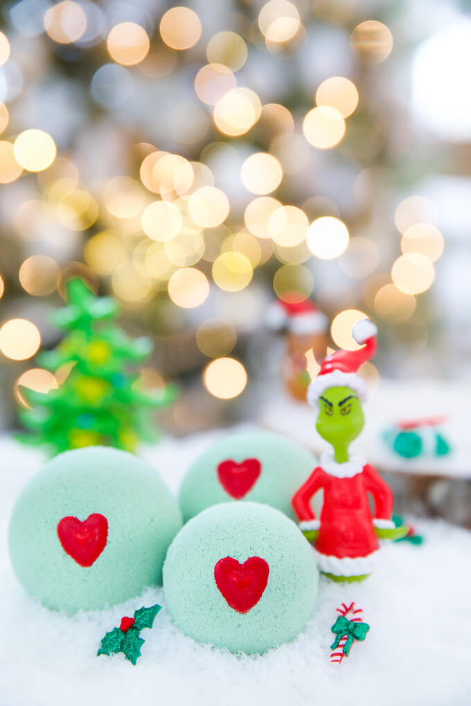 DIY Grinch Bath Bombs Craft Idea With a Red Heart In The Center - Crafting Fizzing Bath Bombs For The Holiday Season With Children