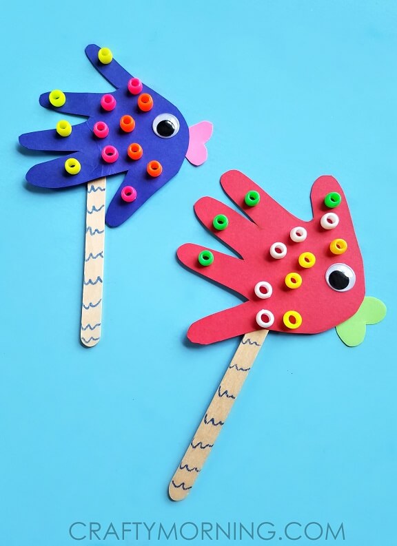 Handprint Fish Puppet Craft Made With Cardstock Paper, Beads, Popsicle Stick, Googly Eye & Blue Marker - Creating Fish Out of Popsicle Sticks in the Home