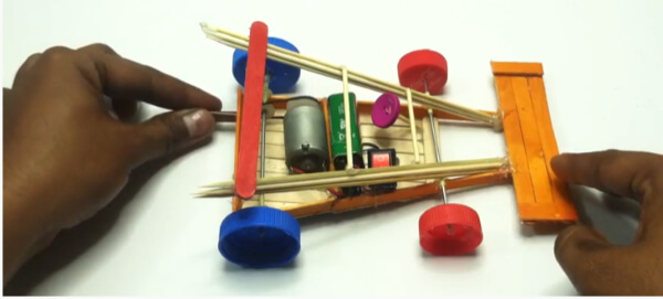 How To Make RC Car Toy Using Popsicle Sticks, Bamboo Sticks, DC Motor, Batter 9 v, & Bottle Caps - Constructing a Motor Vehicle with Popsicle Sticks
