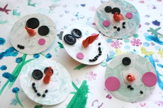 Recycled CD Snowman Ornament Craft For Christmas Using Black Buttons, Orange Tissue Paper, Pink Craft Foam Circles & White Acrylic Paint - Eco-conscious do-it-yourself Christmas trimmings