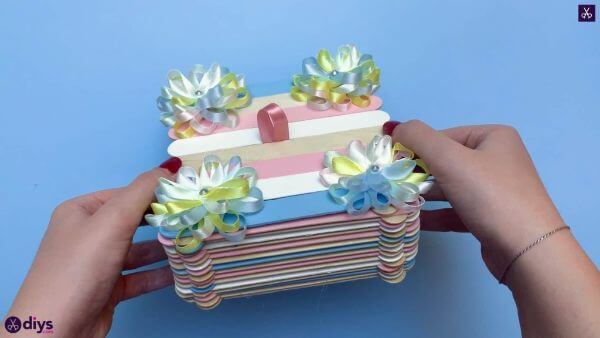 Simple Popsicle Sticks Jewelry Box Craft Using Paintbrush, Ribbons, And Small Rhinestones - Form a Jewelry Box out of Ice Pop Sticks.