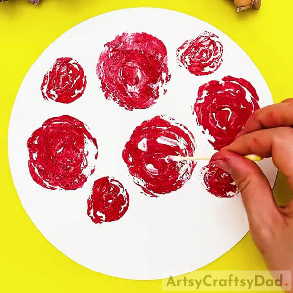 Creating Texture-Cabbage stamps can be transformed into beautiful roses by children.