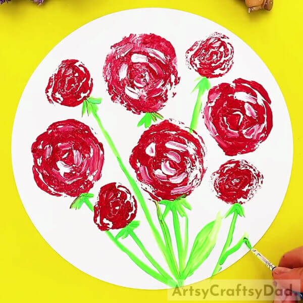 Drawing Some More Stems-Using cabbage stamps to produce roses – an idea perfect for kids.