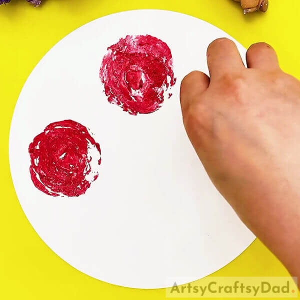 Imprint On The Sheet-Making roses out of cabbage stamps is a fun idea for kids.