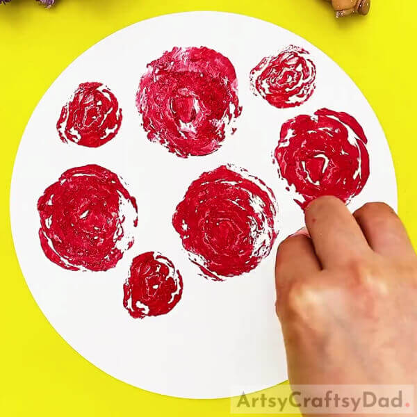 Imprinting More Roses-An artistic way for children to use cabbage stamps – painting roses.