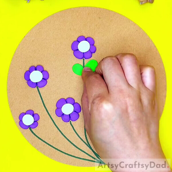 Making The Leaves Of The Flowers With Green Clay-Crafting an intricate bee-filled flower garden with clay for kids 